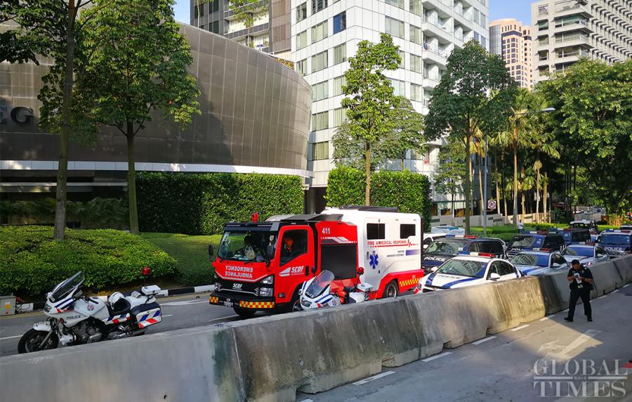 Police and emergency vehicles sit outside the St. Regis Hotel on Sunday where DPRK leader Kim Jong-un is staying. (Photo: Yang Sheng/GT)
DPRK leader Kim Jong-un arrived in Singapore on Sunday for the upcoming summit with U.S. President Donald Trump. These photographs show the preparations ahead of the summit scheduled on June 12 at the Capella Hotel on Sentosa Island, Singapore.