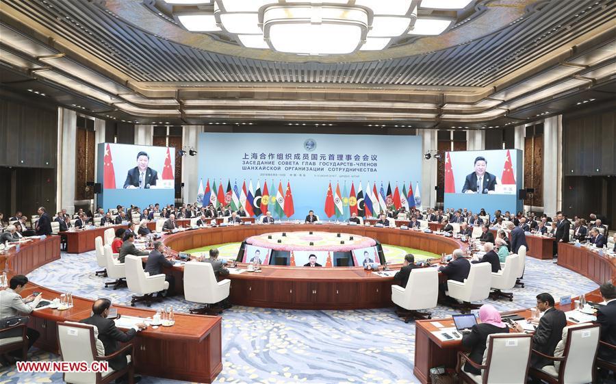 The 18th Meeting of the Council of Heads of Member States of the Shanghai Cooperation Organization (SCO) is held in Qingdao, east China\'s Shandong Province, June 10, 2018. Chinese President Xi Jinping chaired the meeting and delivered a speech. (Xinhua/Ding Lin)