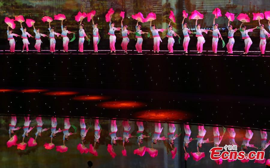 Dancers perform during a light show and fireworks display held to welcome guests attending the 18th Shanghai Cooperation Organization (SCO) Summit in Qingdao, Shandong Province, June 9, 2018. (Photo: China News Service/Mao Jianjun)