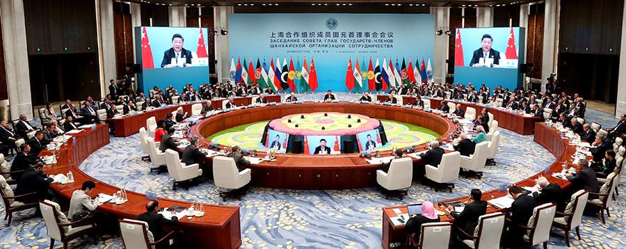 President Xi Jinping delivers a speech at the 18th Meeting of the Council of Heads of Member States of the Shanghai Cooperation Organization in Qingdao, Shandong Province, on Sunday. (Photo/China Daily)