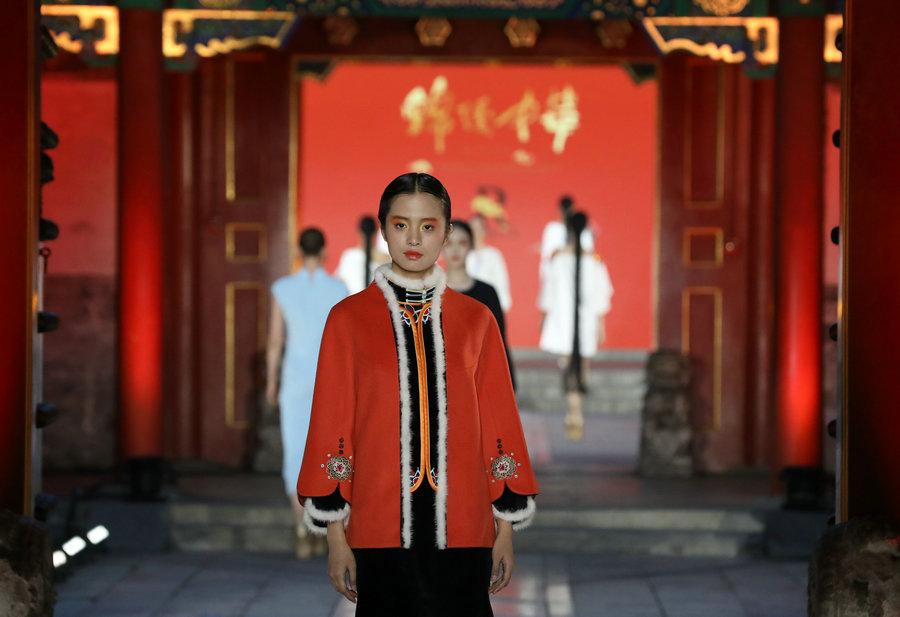 Models present designs by D.Rita at the Prince Kung\'s Mansion in Beijing, June 8, 2018. The runway is a part of \