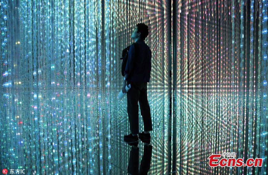 The flower-filled waterfall is the work of Japanese collective teamLab, known internationally for their innovative \