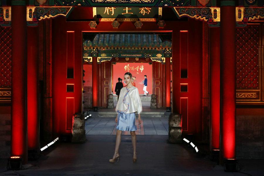Models present designs by D.Rita at the Prince Kung\'s Mansion in Beijing, June 8, 2018. The runway is a part of \