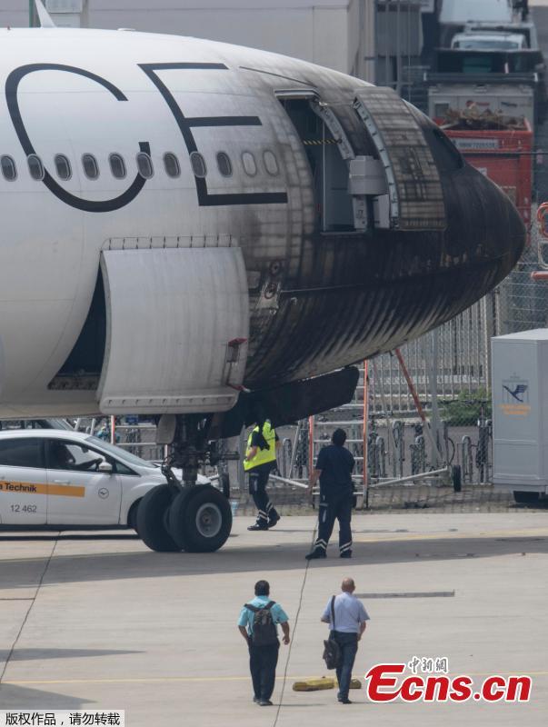 A plane of the Star Alliance is damaged after a push-car caught fire at the airport in Frankfurt, Germany, June 11, 2018. German airline Lufthansa says 10 airport workers have suffered minor injuries from smoke inhalation when a vehicle pulling a jet to a gate caught on fire. (Photo/Agencies)