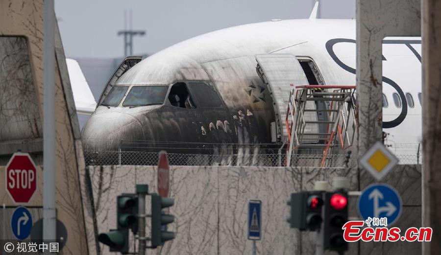 A plane of the Star Alliance is damaged after a push-car caught fire at the airport in Frankfurt, Germany, June 11, 2018. German airline Lufthansa says 10 airport workers have suffered minor injuries from smoke inhalation when a vehicle pulling a jet to a gate caught on fire. (Photo/Agencies)
