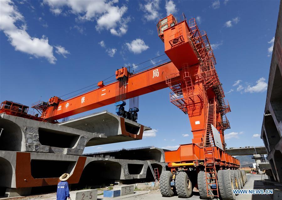 Workers work at a construction site of the Beijing-Zhangjiakou high-speed railway in Zhangjiakou, north China\'s Hebei Province, June 10, 2018. The railway, connecting China\'s capital Beijing and Zhangjiakou of north China\'s Hebei Province, is designed at a speed of 350 kilometers per hour and is expected to be put into use at the end of 2019. (Xinhua/Yang Shiyao)