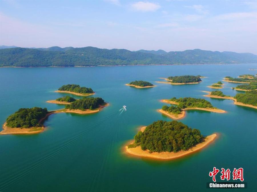 A view of the Weishui Reservoir in Songzi City, Central China’s Hubei Province. The S-shaped reservoir dam is 8,968 meters long and said to be the longest earth-filled man-made dam in Asia. The reservoir contains hundreds of islands, making it a top tourist attraction, and it is also home to a leading camping site. (Photo: China News Service/Zhou Xingliang)