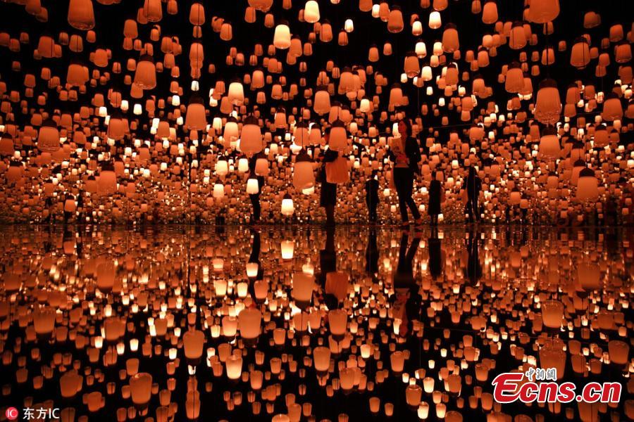 The flower-filled waterfall is the work of Japanese collective teamLab, known internationally for their innovative \