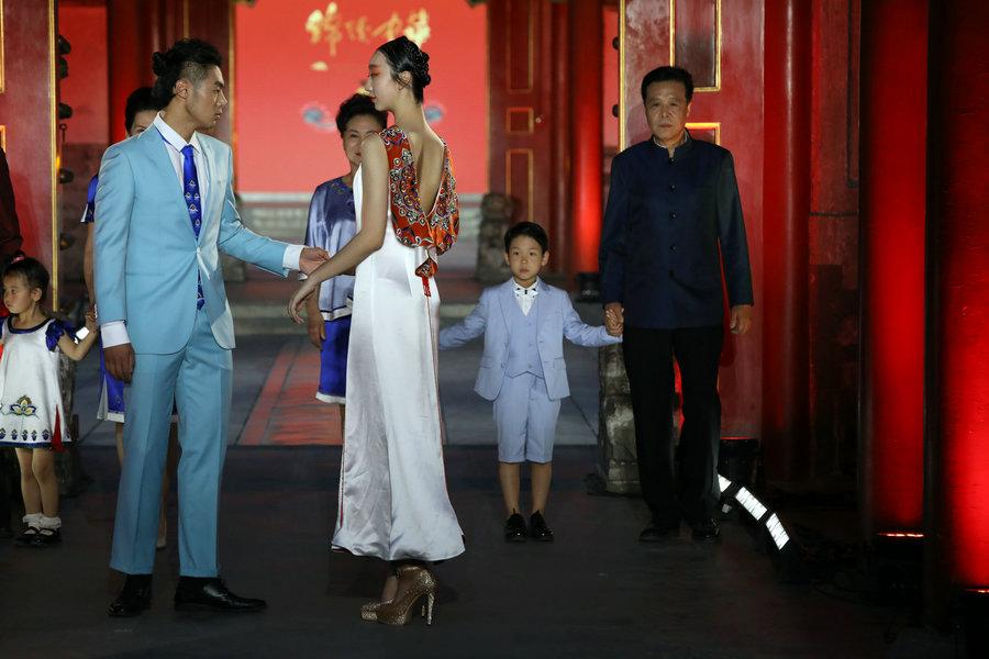 Models present designs by D.Rita at the Prince Kung\'s Mansion in Beijing, June 8, 2018. The runway is a part of \