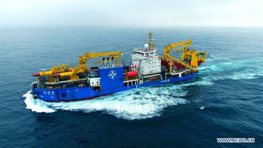 Tian Kun Hao, a Chinese-built dredging vessel, the largest of its kind in Asia, sails under a sea trial after departing a port in east China\'s Jiangsu Province, June 12, 2018. Tian Kun Hao, constructed by Tianjin Dredging Co. Ltd., a subsidiary of China Communication Construction Co., Ltd. (CCCC), finished its first sea trial. The 140-meter-long vessel, with the designed capacity to dredge 6,000 cubic meters per hour, can dig as deep as 35 meters under the sea floor. (Xinhua/Mao Zhenhua)