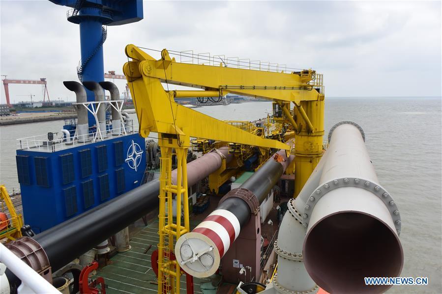 Photo taken on June 7, 2018 shows Tian Kun Hao, a Chinese-built dredging vessel, the largest of its kind in Asia, in east China\'s Jiangsu Province. Tian Kun Hao, constructed by Tianjin Dredging Co. Ltd., a subsidiary of China Communication Construction Co., Ltd. (CCCC), finished its first sea trial. The 140-meter-long vessel, with the designed capacity to dredge 6,000 cubic meters per hour, can dig as deep as 35 meters under the sea floor. (Xinhua/Mao Zhenhua)