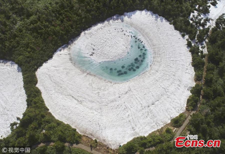 In this aerial image, Kagaminuma Pond is seen on June 5, 2018 in Iwate, Japan. Snow melting water creates an eye-shaped pond on the Hachimantai mountain. (Photo/VCG)
