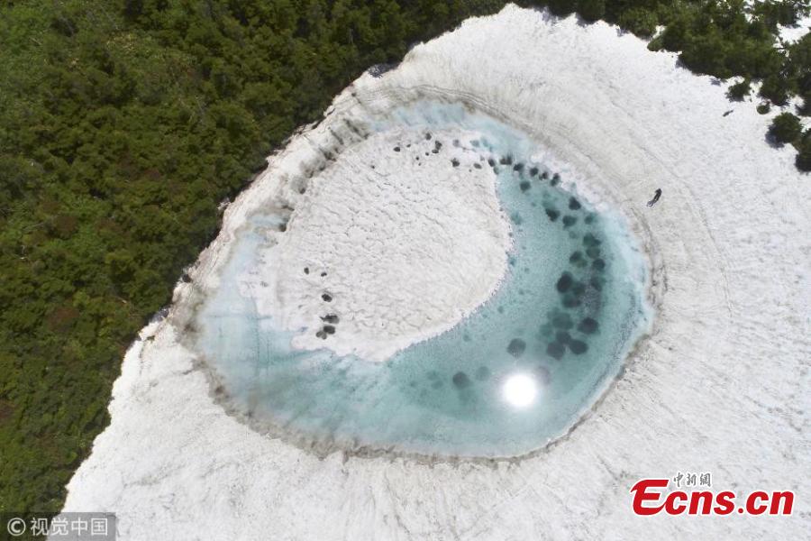 In this aerial image, Kagaminuma Pond is seen on June 5, 2018 in Iwate, Japan. Snow melting water creates an eye-shaped pond on the Hachimantai mountain. (Photo/VCG)