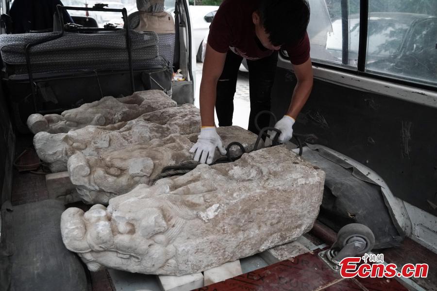 Four white marble building pieces are transported from the Qinghe Sub-district Administration Office in Haidian District, Beijing to the Older Summer Palace for preservation, June 12, 2018. The four cultural relics were found at a construction site in 2017, and experts believe they were originally part of buildings in the Old Summer Palace, a garden for the royal family during the Qing Dynasty (1644-1911) that was known as the \
