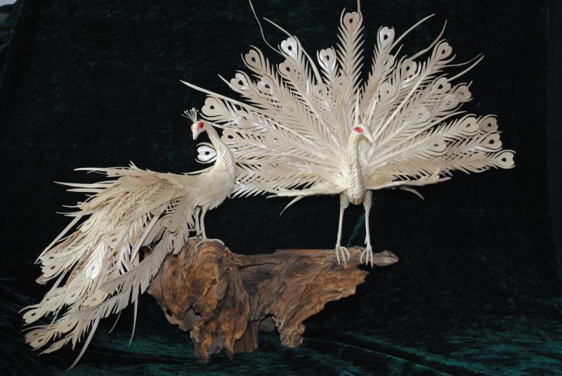 Palm leaves art created by artist Zhou Jialin. (Photo by Song Guoqing/China Daily)