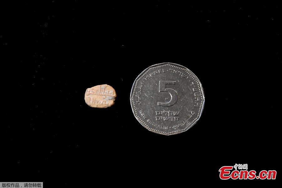Israeli archaeologists have unearthed a rare 1,000-year-old clay amulet bearing an inscription in Arabic at a parking lot in the East Jerusalem, Israel\'s antiquities authority said Thursday, June 14, 2018. The tiny object, which has a diameter of less than 1 centimeter, was dug up at the Givati Parking Lot just outside Jerusalem\'s Old City, and is inscribed with the following two-line personal prayer: \