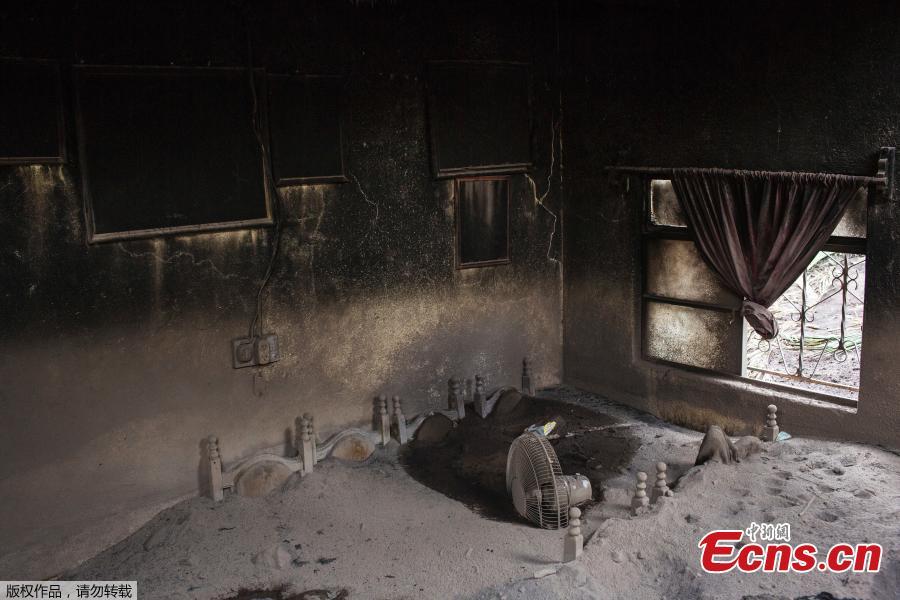 A view of a house affected by the eruption of the Fuego volcano at San Miguel Los Lotes in Escuintla, Guatemala. Everything in the previously lush, bright green landscape is coated in thick layers of sepia-colored volcanic ash, giving the place the eerie feeling of a ghost ship. (Photo/Agencies)