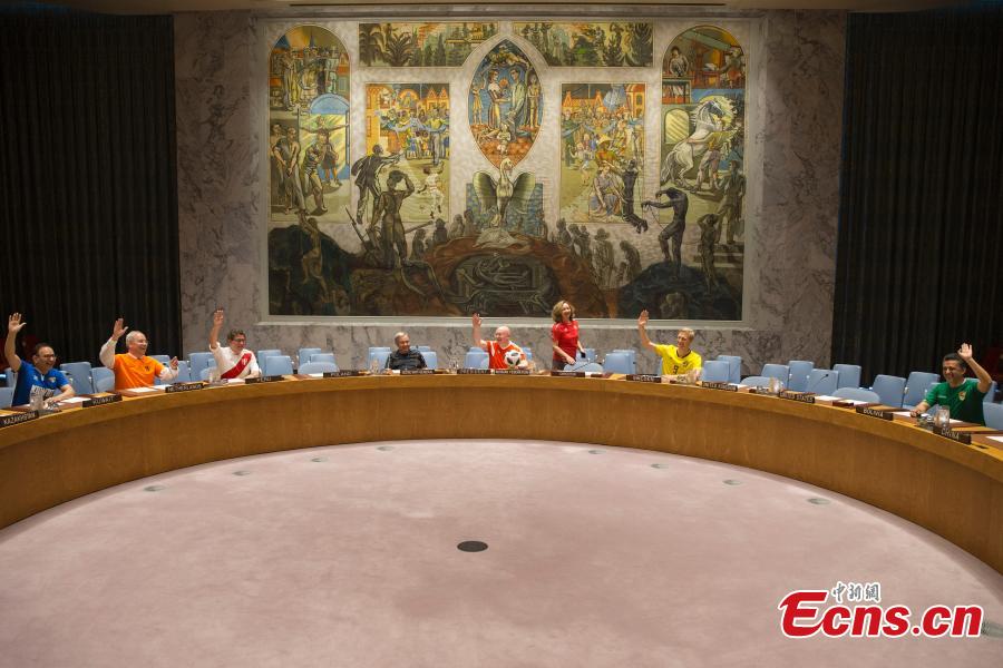 Members of the United Nations Security Council pose for a picture while wearing soccer jerseys to commemorate the inauguration of the World Cup, at the United Nations headquarters in New York City, New York, U.S, June 14, 2018. (Photo: China News Service/Liao Pan)