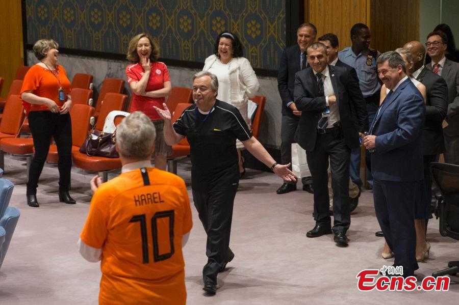 Members of the United Nations Security Council pose for a picture while wearing soccer jerseys to commemorate the inauguration of the World Cup, at the United Nations headquarters in New York City, New York, U.S, June 14, 2018. (Photo: China News Service/Liao Pan)