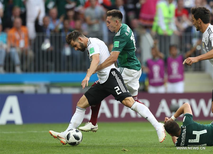 Marvin Plattenhardt (L) of Germany vies with Hector Herrera of Mexico during a group F match between Germany and Mexico at the 2018 FIFA World Cup in Moscow, Russia, June 17, 2018. (Xinhua/Xu Zijian)