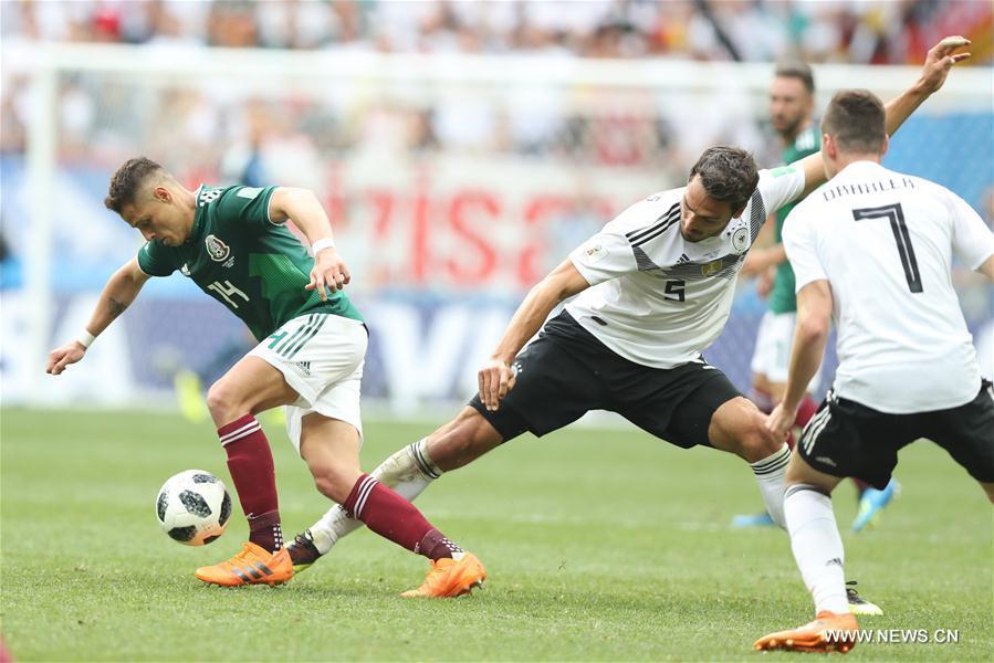 Mats Hummels (C) of Germany vies with Javier Hernandez (L) of Mexico during a group F match between Germany and Mexico at the 2018 FIFA World Cup in Moscow, Russia, June 17, 2018. (Xinhua/Xu Zijian)