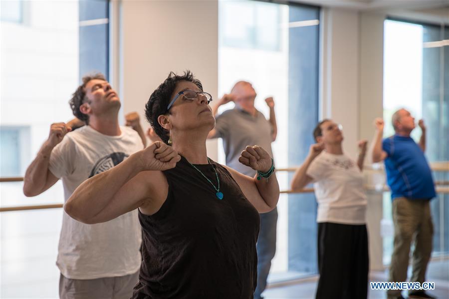 Israelis learn Tai Chi at the Chinese Cultural Center in Tel Aviv, Israel, on June 18, 2018. The Chinese Cultural Center provides locals with a series of courses introducing Chinese culture. (Xinhua/Guo Yu)