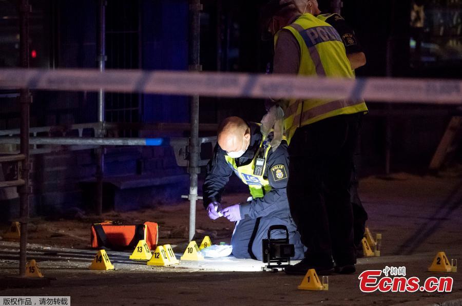 Police forensics investigate the scene after people were shot and injured outside an Internet Cafe in Malmo, southern Sweden, June 18, 2018. Swedish police said Tuesday that a shooting in the southern city of Malmo has resulted in the death of two people who sustained critical injures during the incident. The drive-by shooting occurred Monday night and all the five injured during the incident were sent to hospital, with one of them having succumbed to his wounds soon afterwards.(Photo/Agencies)