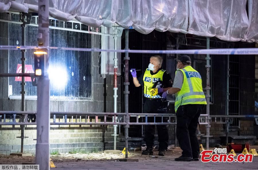 Police forensics investigate the scene after people were shot and injured outside an Internet Cafe in Malmo, southern Sweden, June 18, 2018.Swedish police said Tuesday that a shooting in the southern city of Malmo has resulted in the death of two people who sustained critical injures during the incident. The drive-by shooting occurred Monday night and all the five injured during the incident were sent to hospital, with one of them having succumbed to his wounds soon afterwards.(Photo/Agencies)