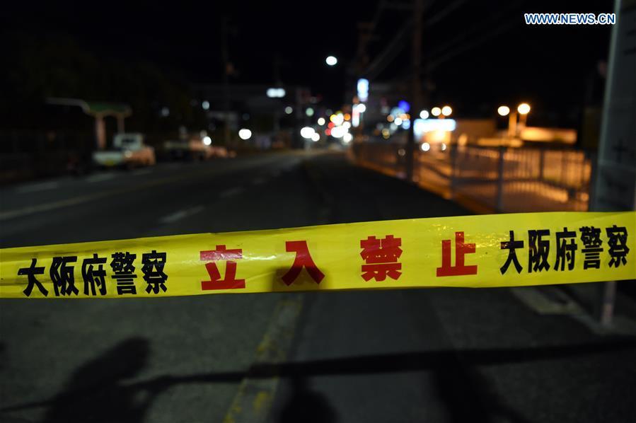 A site of a damaged road is blocked in Osaka, Japan, on June 18, 2018. At least three people have been confirmed dead and more than 90 others injured as a result of a 6.1 magnitude earthquake striking Osaka prefecture in western Japan on Monday morning. (Xinhua/Ma Ping)
