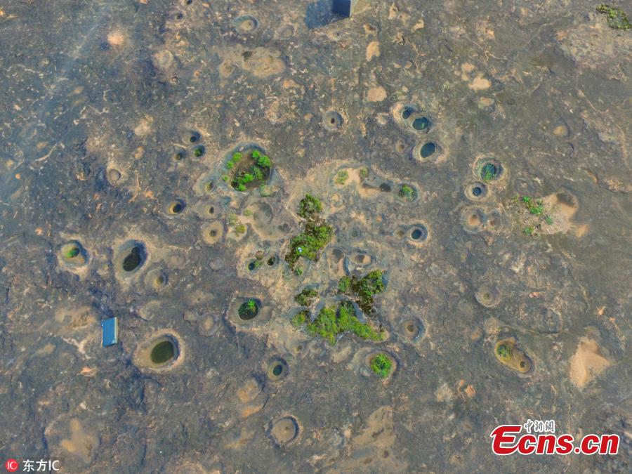 Photo taken on June 19, 2018 shows rare landforms left after the land was carved by glacier some two million years ago in Shennonggu Danxia scenic area in Anren County, Chenzhou City, Central China’s Hunan Province. (Photo/IC)