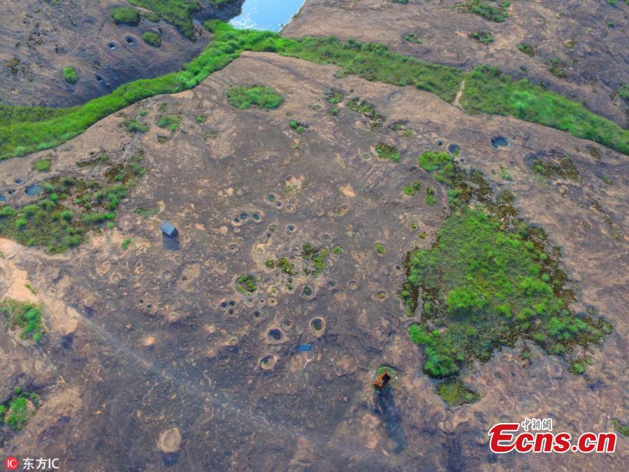 Photo taken on June 19, 2018 shows rare landforms left after the land was carved by glacier some two million years ago in Shennonggu Danxia scenic area in Anren County, Chenzhou City, Central China’s Hunan Province. (Photo/IC)