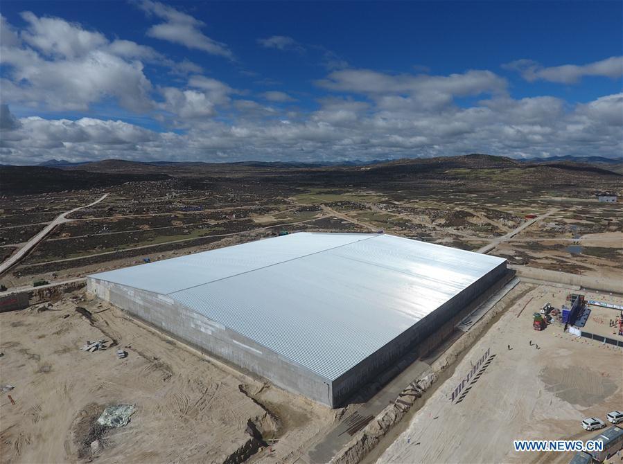 Aerial photo taken on June 19, 2018 shows the Water Cherenkov Detector in the Large High Altitude Air Shower Observatory (LHAASO) which is under construction in Daocheng County, southwest China\'s Sichuan Province. An observatory for detecting cosmic rays is being built in Sichuan Province. The project, known as the LHAASO, is located in mountains of the eastern part of Qinghai-Tibet Plateau at an average altitude of 4,410 meters. (Xinhua/Liu Kun)