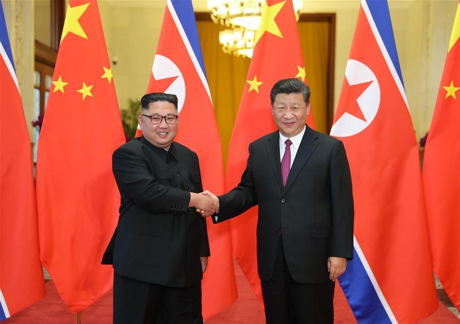Xi Jinping (R), general secretary of the Central Committee of the Communist Party of China (CPC) and Chinese president, holds talks with Kim Jong Un, chairman of the Workers\' Party of Korea and chairman of the State Affairs Commission of the Democratic People\'s Republic of Korea (DPRK), in Beijing, capital of China, June 19, 2018. (Xinhua/Ju Peng)