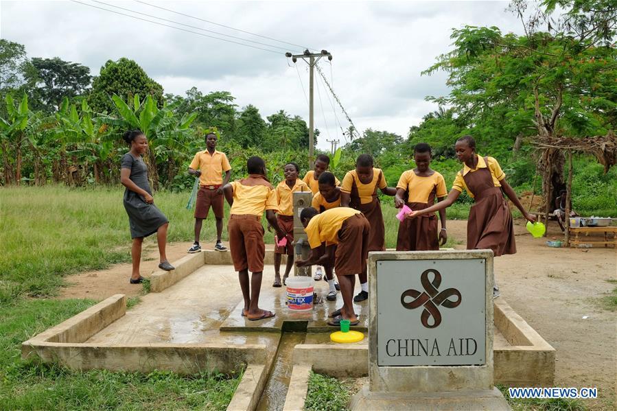 Children fetch water from a borehole in Guayotse Village, Eastern Region, Ghana, on June 18, 2018. The government of China is providing 1,000 boreholes for hundreds of rural communities in six out of the ten regions of Ghana to bring clean water to the people. (Xinhua/Zhao Shuting)