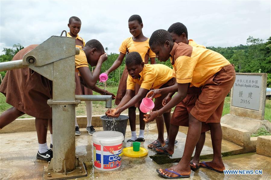 Children fetch water from a borehole in Guayotse Village, Eastern Region, Ghana, on June 18, 2018. The government of China is providing 1,000 boreholes for hundreds of rural communities in six out of the ten regions of Ghana to bring clean water to the people. (Xinhua/Zhao Shuting)