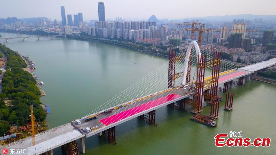 The main structure of the Baisha Bridge in Liuzhou City, South China’s Guangxi Zhuang Autonomous Region, is complete. It’s the world’s largest asymmetrical cable-stayed bridge, with the highest point of the main tower at 106 meters. (Photo/IC)