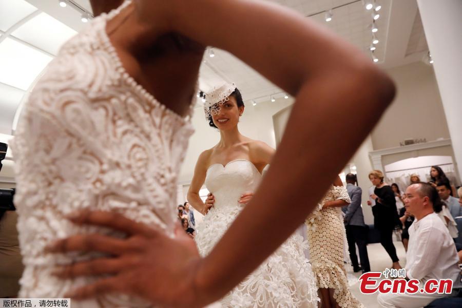 Models present their wedding gowns during the 14th Annual Toilet Paper Wedding Dress Contest in Manhattan, New York, U.S., June 20, 2018. (Photo/Agencies)