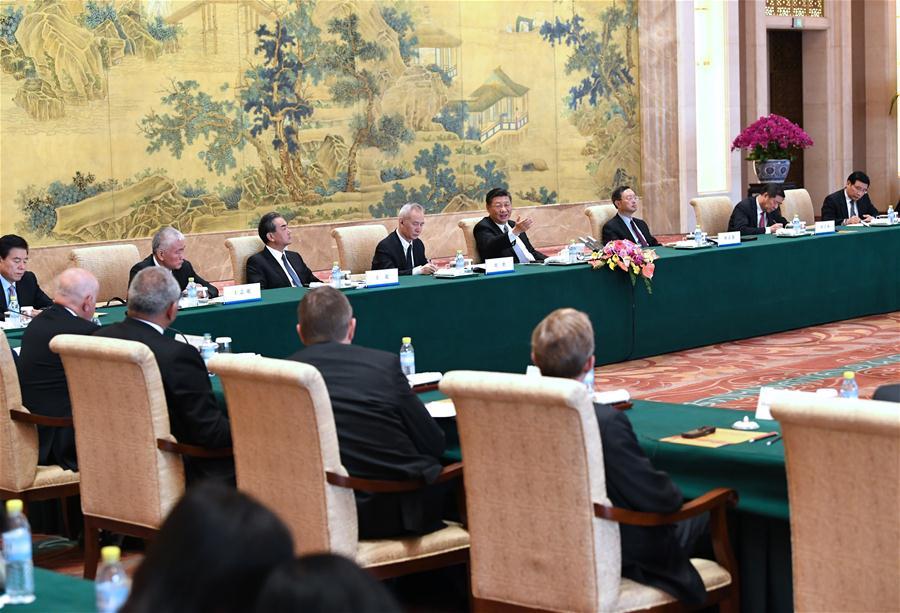 Chinese President Xi Jinping attends a symposium with executives of some famous multinational enterprises, who are in Beijing to attend a special session of round-table summit of Global CEO Council at the Diaoyutai State Guesthouse in Beijing, capital of China, June 21, 2018. (Xinhua/Rao Aimin)