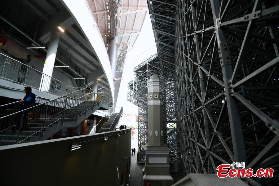 The enormous temporary stand at the World Cup stadium in Ekaterinburg, Russia. FIFA regulations state that each World Cup venue must have a minimum capacity of 35,000. The stadium only held 23,000 spectators and renovation was impossible with time quickly running out, so the enormous temporary stands were erected at either end of the pitch to reach the requirement. (Photo: China News Service/Fu Tian)