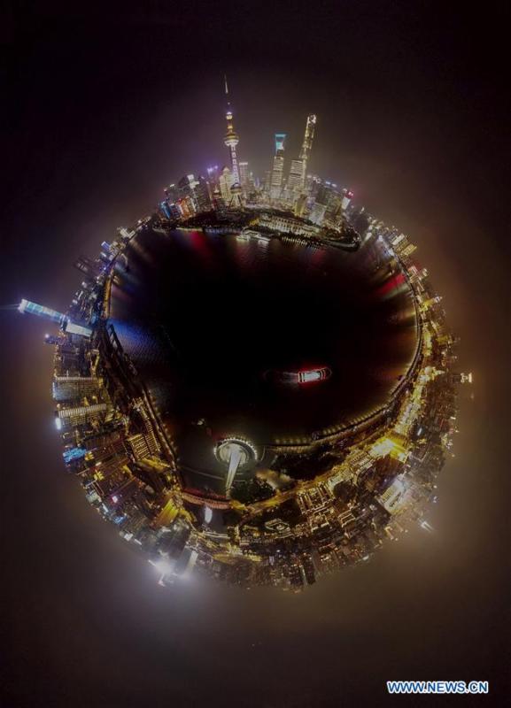 Aerial photo taken on June 21, 2018 shows night view of the Lujiazui area in Pudong of Shanghai, east China. China announced the opening-up and development of Pudong in 1990. Pudong is expecting to take the opportunity of celebrating the 40th anniversary of China\'s reform and opening-up to continue to spearhead the country\'s reform and development. (Xinhua/Yin Gang)