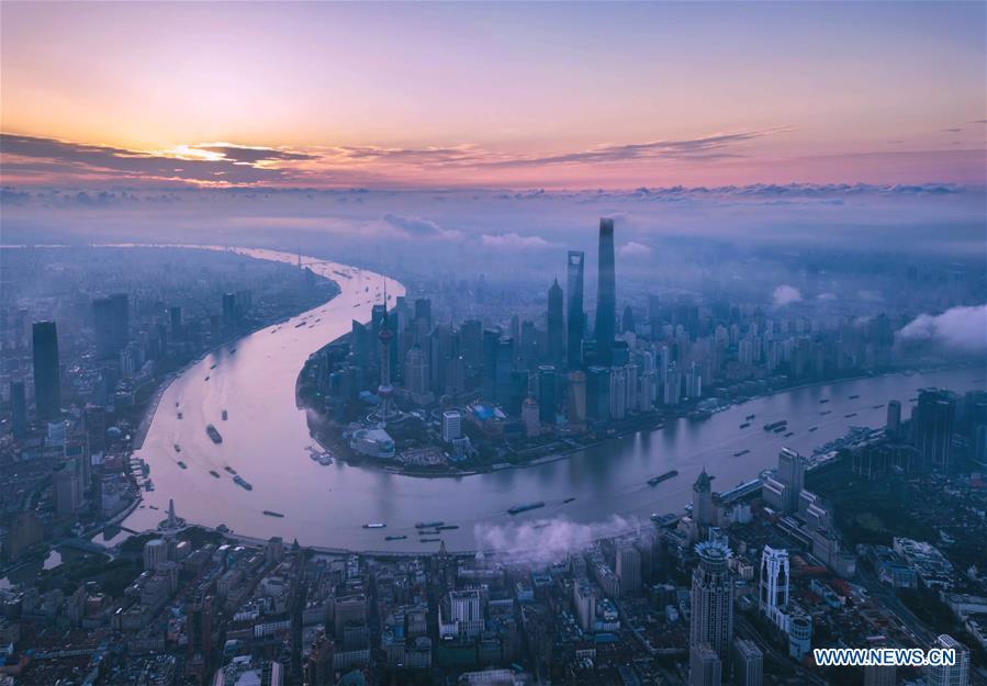 Aerial photo taken on June 21, 2018 shows morning view of the Lujiazui area in Pudong of Shanghai, east China. China announced the opening-up and development of Pudong in 1990. Pudong is expecting to take the opportunity of celebrating the 40th anniversary of China\'s reform and opening-up to continue to spearhead the country\'s reform and development. (Xinhua/Ren Long)
