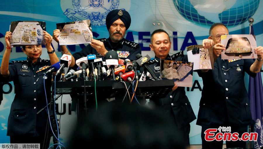 Amar Singh, head of Malaysia\'s Commercial Crime Investigation Department (CCID), and other police officers display photos of items from a raid on former Malaysian Prime Minister Najib Razak\'s premises during a news conference in Kuala Lumpur, Malaysia June 27, 2018. Malaysian police say the total value of cash, jewelry and hundreds of watches and handbags seized from properties linked to Najib in a money-laundering investigation amounted to $273 million. (Photo/Agencies)