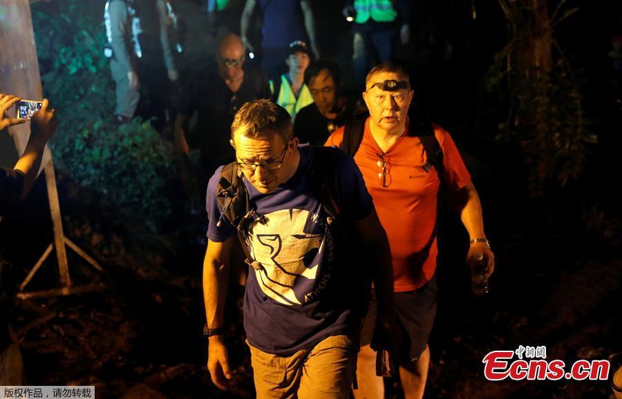British divers John Volanthen and Robert Charles Harper leave after they checked the Tham Luang caves during a search for the members of an under-16 soccer team and their coach, in the northern province of Chiang Rai, Thailand, June 27, 2018. (Photo/Agencies)