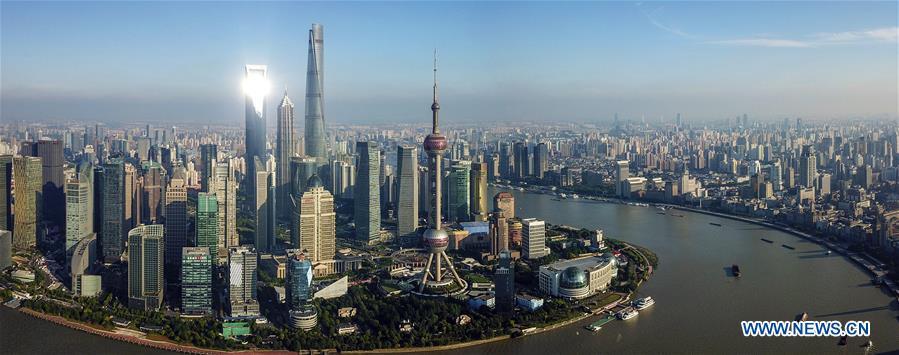 Stitched photo taken on June 21, 2018 shows scenery of the Lujiazui area in Pudong of Shanghai, east China. China announced the opening-up and development of Pudong in 1990. Pudong is expecting to take the opportunity of celebrating the 40th anniversary of China\'s reform and opening-up to continue to spearhead the country\'s reform and development. (Xinhua/Yin Gang)