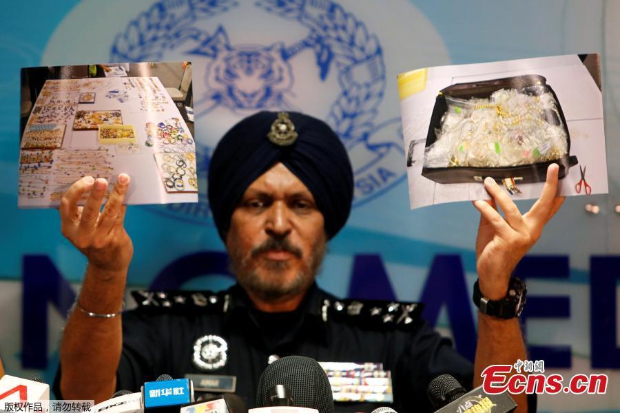 Amar Singh, head of Malaysia\'s Commercial Crime Investigation Department (CCID), displays photos of items from a raid on former Malaysian Prime Minister Najib Razak\'s premises during a news conference in Kuala Lumpur, Malaysia June 27, 2018.Malaysian police say the total value of cash, jewelry and hundreds of watches and handbags seized from properties linked to former Prime Minister Najib Razak in a money-laundering investigation amounted to $273 million. (Photo/Agencies)