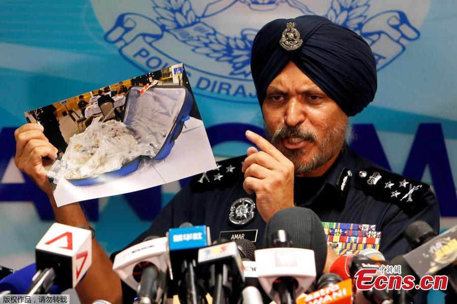 Amar Singh, head of Malaysia\'s Commercial Crime Investigation Department (CCID), displays photos of items from a raid on former Malaysian Prime Minister Najib Razak\'s premises during a news conference in Kuala Lumpur, Malaysia June 27, 2018.Malaysian police say the total value of cash, jewelry and hundreds of watches and handbags seized from properties linked to former Prime Minister Najib Razak in a money-laundering investigation amounted to $273 million. (Photo/Agencies)