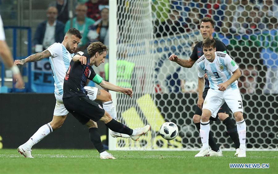 Luka Modric (2nd L) of Croatia shoots to score during the 2018 FIFA World Cup Group D match between Argentina and Croatia in Nizhny Novgorod, Russia, June 21, 2018. Croatia won 3-0. (Xinhua/Wu Zhuang)
Best goal
Yes, Argentina\'s defence has at times been dire in this tournament, but that should take nothing away from Luka Modric\'s spectacular goal for Croatia against the Albiceleste in Nizhny Novgorod. The Real Madrid midfielder dummied onto his left side before daintily shifting back to the right and curling a 30-yard strike into the top right corner, all but securing his team a place in the next stage.