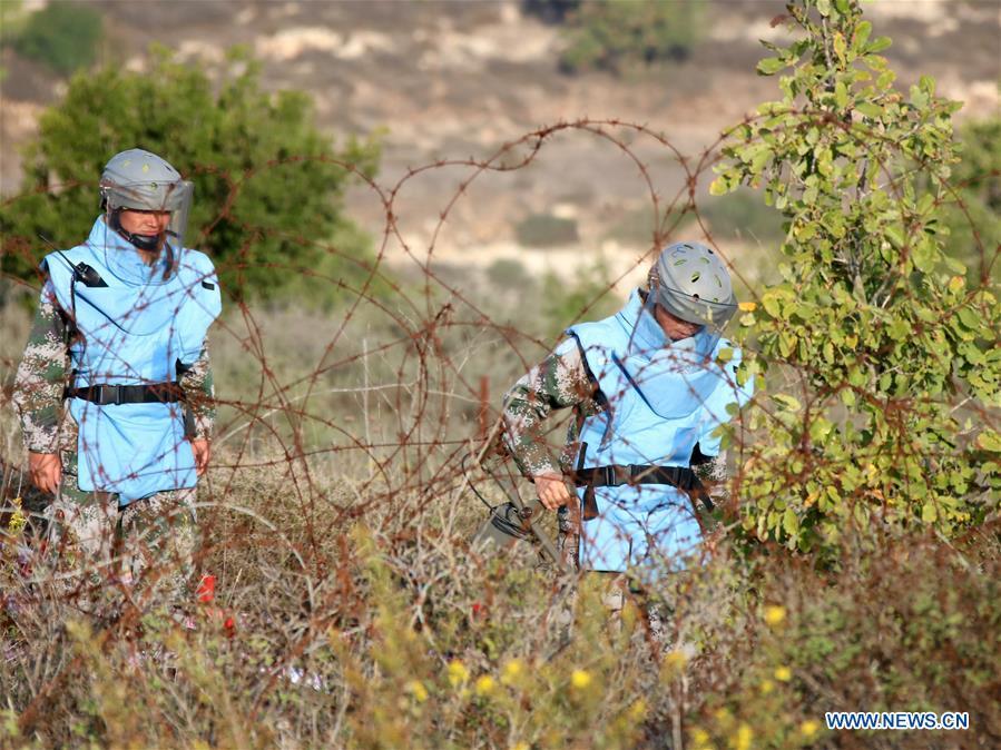 The photo taken on Nov. 8, 2017 shows Chinese peacekeepers working at a minefield near the UN demarcated \