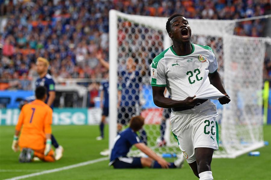 Moussa Wague (R front) of Senegal celebrates scoring during the 2018 FIFA World Cup Group H match between Japan and Senegal in Yekaterinburg, Russia, June 24, 2018. (Xinhua/Chen Cheng)
Most unlucky
Senegal can consider themselves desperately unfortunate not to advance to the round of 16. The African team defeated Poland in their opening match and looked the better side for long periods in a 2-2 draw with Japan. They paid the price for not capitalizing on their early dominance against Colombia on Thursday, losing 1-0. Despite finishing level with Japan on points, goals for and goals conceded, the Lions of Teranga were eliminated for having picked up more yellow cards.