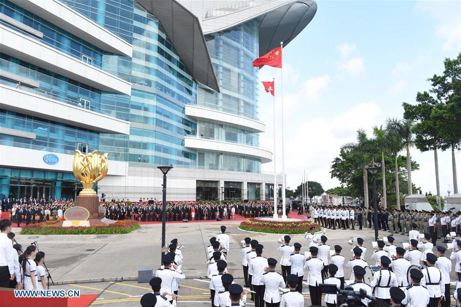 A flag-raising ceremony is held at Golden Bauhinia Square to celebrate the 21st anniversary of Hong Kong\'s return to the motherland, in Hong Kong, south China, July 1, 2018. (Xinhua/Qin Qing)
